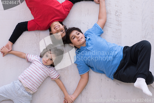 Image of young boys having fun on the floor