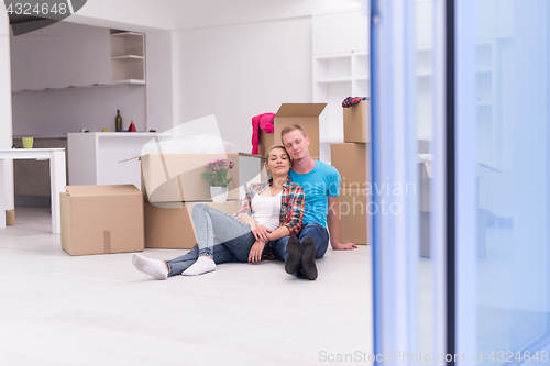 Image of young couple moving  in new house