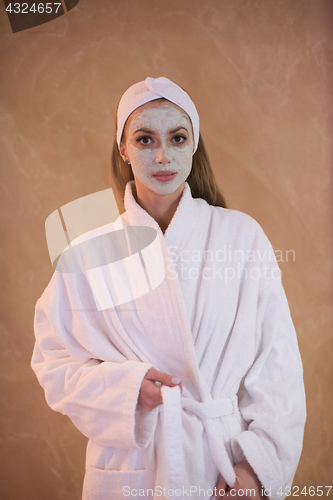 Image of Spa Woman applying Facial Mask