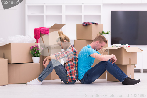 Image of young couple moving  in new house