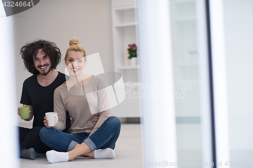 Image of young couple in their new home