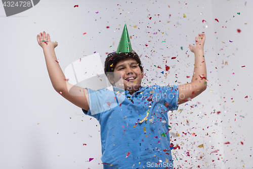 Image of kid blowing confetti