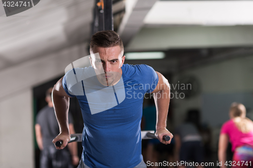 Image of man doing exercises parallel bars