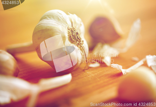 Image of close up of garlic on wooden table