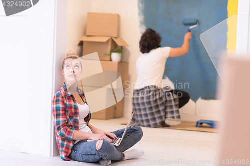 Image of Happy couple doing home renovations