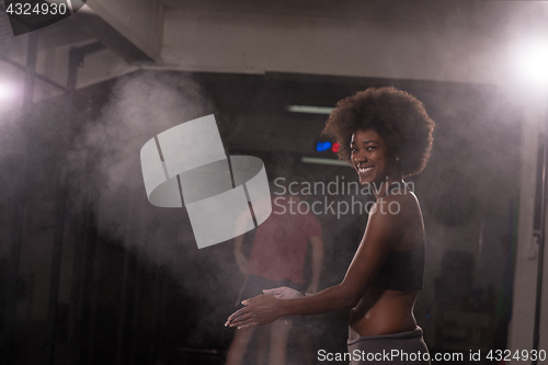 Image of black woman preparing for climbing workout