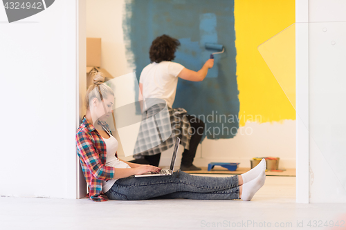 Image of Happy couple doing home renovations