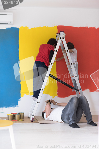 Image of boys painting wall