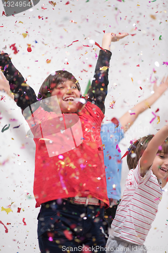 Image of kids  blowing confetti