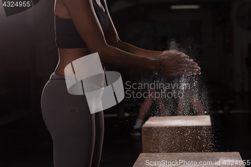 Image of black woman preparing for climbing workout