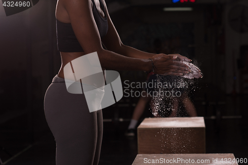 Image of black woman preparing for climbing workout