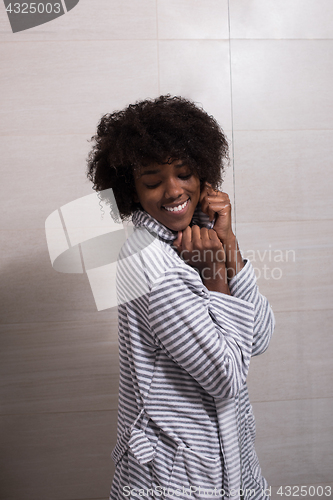 Image of beautiful black woman wearing  bathrobe