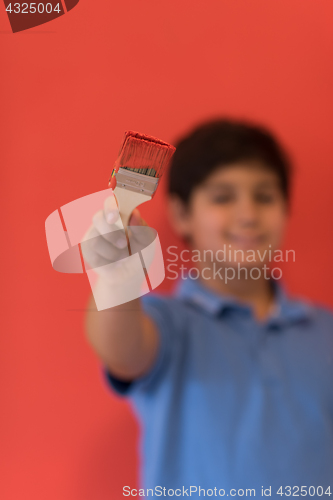 Image of Portrait of a happy young boy painter