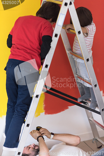 Image of boys painting wall