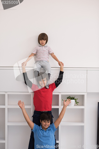 Image of young boys posing line up piggyback