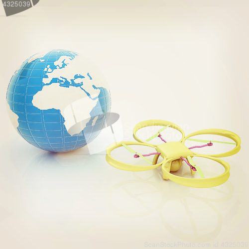 Image of Quadrocopter Drone with Earth Globe and remote controller on a w