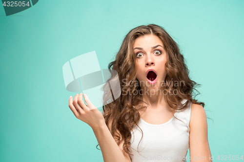 Image of Portrait of young woman with shocked facial expression