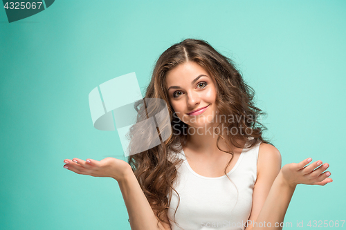 Image of Portrait of young woman with shocked facial expression