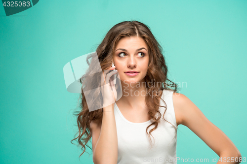 Image of The portrait of disgusted woman with mobile phone