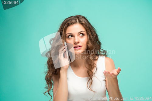 Image of The portrait of disgusted woman with mobile phone