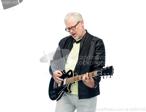 Image of happy senior man playing electric guitar