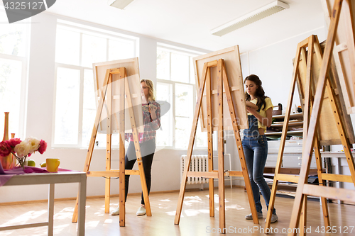 Image of woman artists or students painting at art school