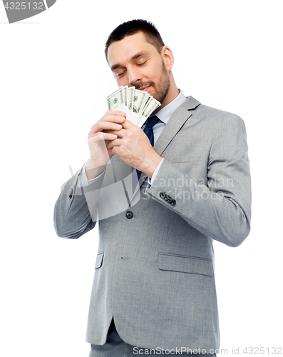 Image of businessman smelling american dollar money