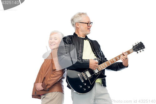 Image of happy senior couple with electric guitar