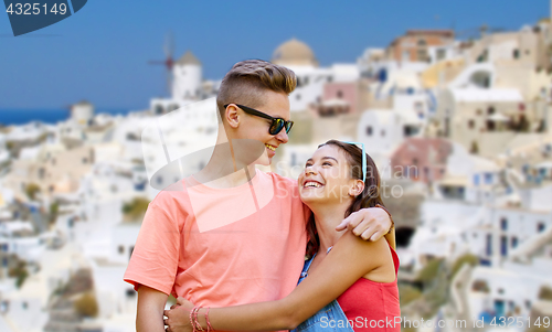 Image of happy teenage couple on santorini island