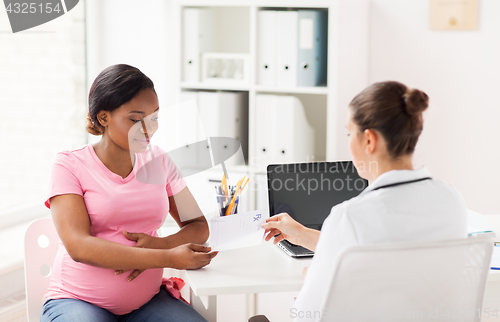 Image of gynecologist doctor and pregnant woman at hospital