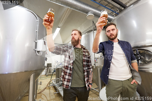 Image of men testing non-alcoholic craft beer at brewery