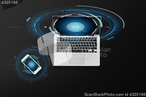 Image of laptop computer and smartphone top view