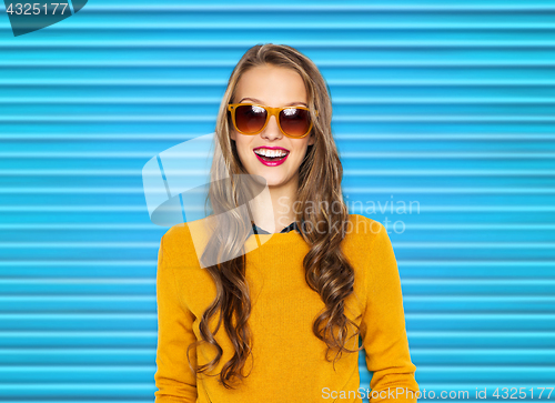 Image of happy young woman or teen girl in casual clothes