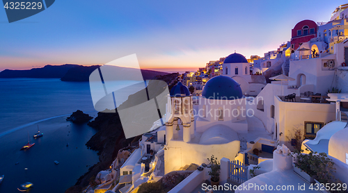 Image of Traditional greek village of Oia at dusk, Santorini island, Greece.