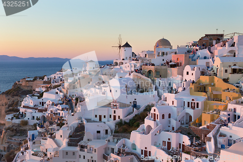 Image of Oia village at sunset, Santorini island, Greece.