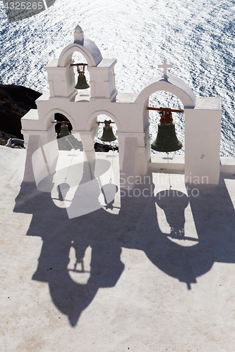 Image of Traditional bell tower in Oia village of Cyclades Island, Santorini, Greece.