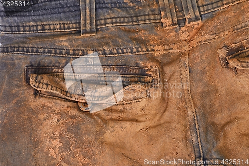 Image of Trousers with mud