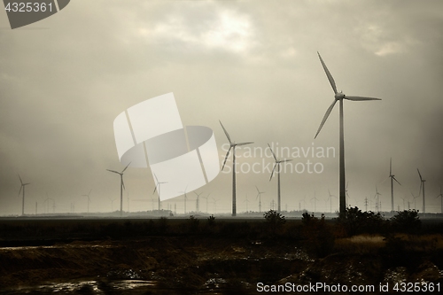 Image of Wind tubines in rain