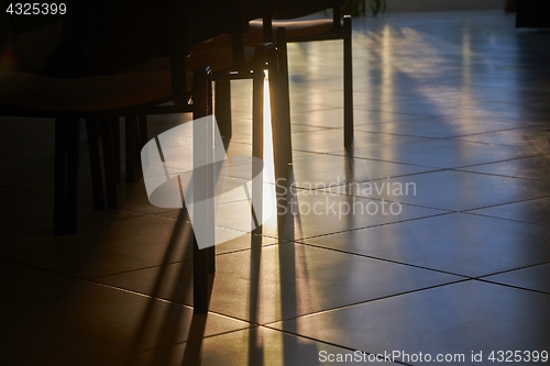 Image of Sunlight glow between classroom chairs