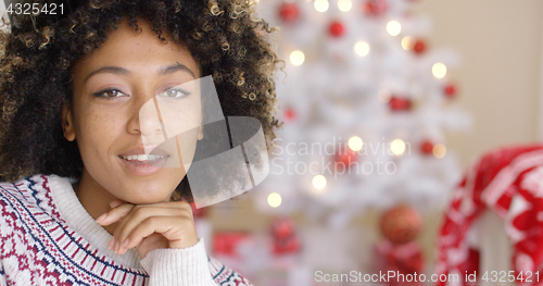 Image of Close up on happy woman near Christmas tree