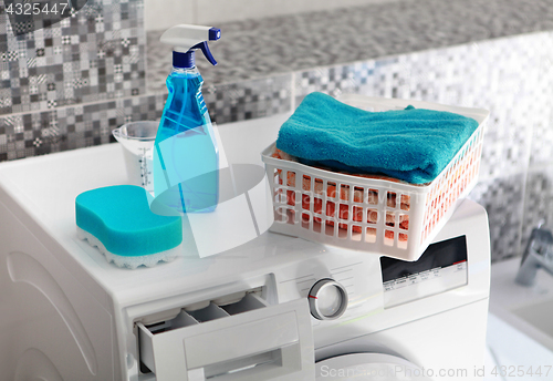 Image of laundry powder on washing machine