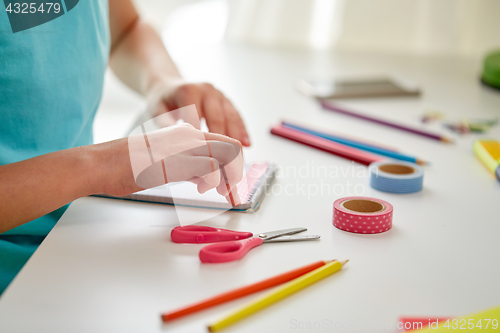 Image of girl hands making something at home