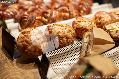 Image of bread, buns and sandwiches with price at store