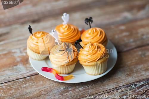 Image of halloween party cupcakes or muffins on table