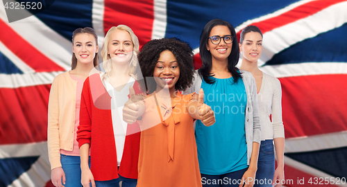 Image of international english women showing thumbs up