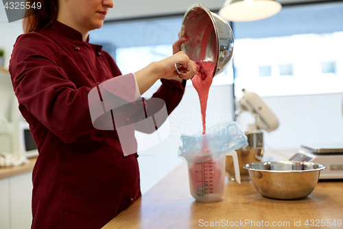 Image of chef making macaron batter at kitchen