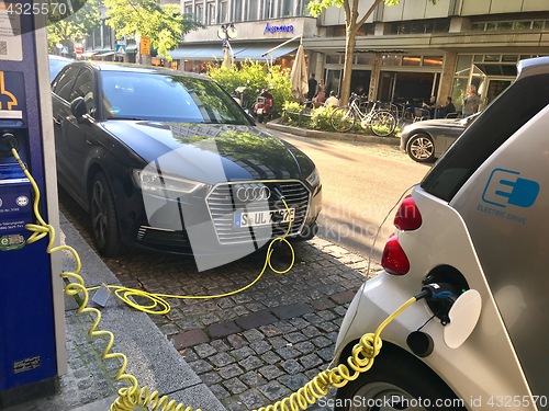 Image of Close up of electric cars being charging