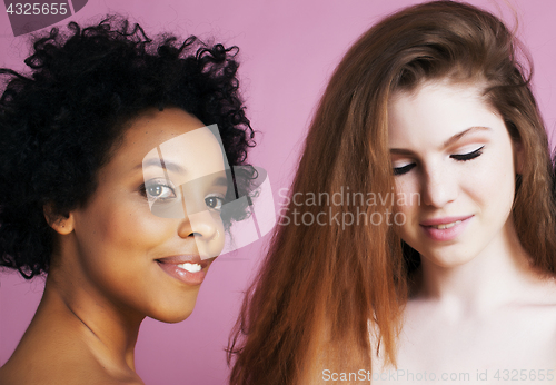 Image of different nation girls with diversuty in skin, hair. scandinavian, african american cheerful emotional posing on pink background, woman day celebration, lifestyle people concept 