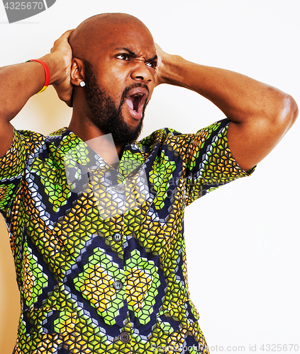 Image of portrait of young handsome african man wearing bright green nati