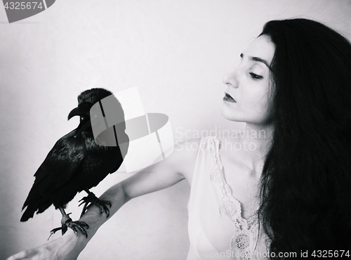 Image of young woman with raven